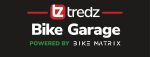 Cyclist checking bike parts compatibility on a laptop screen